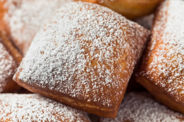Homemade New Orleans French Beignets Homemade New Orleans French Beignets with Powdered Sugar beignet stock pictures, royalty-free photos & images