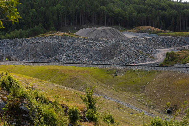 istock Highway under construction cutting throgh a hillside. 1383549510