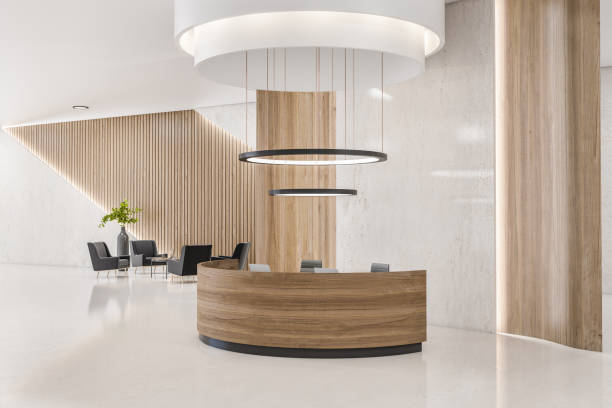 istock Contemporary wooden and concrete office reception interior with desk and other objects. Waiting area concept. 3D Rendering. 1383552348