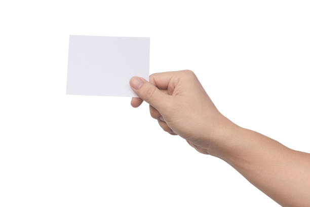 istock Hand holding white paper isolated on white 1383552531