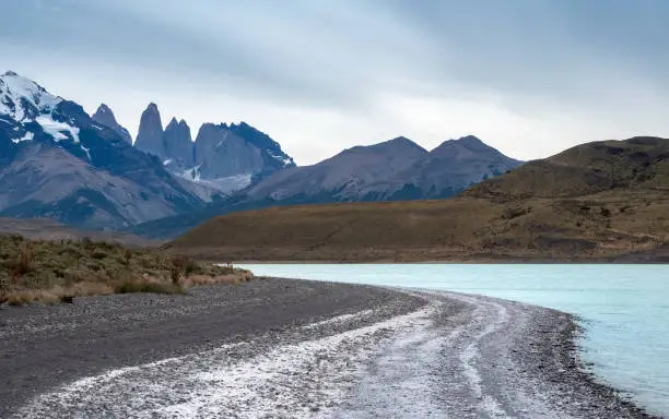 Photo of Laguna Amarga (Bitter Lagoon) with breathtaking views of the distinctive three granite peaks of the Paine mountain range. Torres del Paine National Park, southern Patagonia, Magallanes, Chile