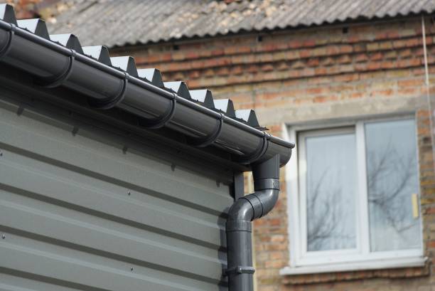 istock black plastic drain pipe on the iron wall of the building 1383556519