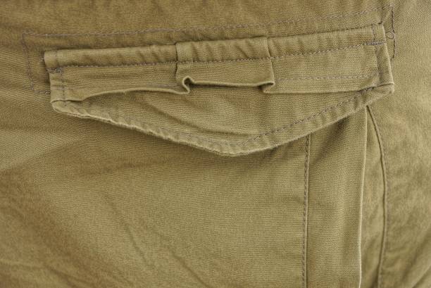 istock brown green fabric texture from crumpled clothes 1383556579