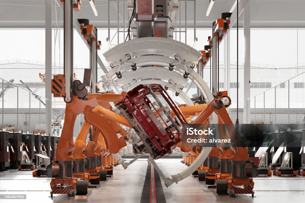 3d rendering of industrial robots at the automatic car manufacturing factory assembly line Robotic arms working on the assembly line of automobile manufacturing plant. 3d rendering of industrial robots at the automatic car manufacturing factory assembly line. Manufacturing Stock Photo