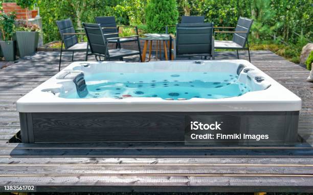 Large Hot Tub Embedded In The Backyard Terrace Stock Photo - Download Image Now - Hot Tub, Autumn, Patio