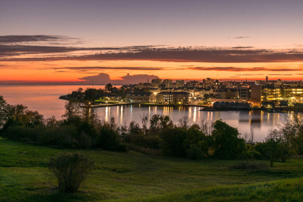 istock Lakeside city at dusk in autumn 1383583071