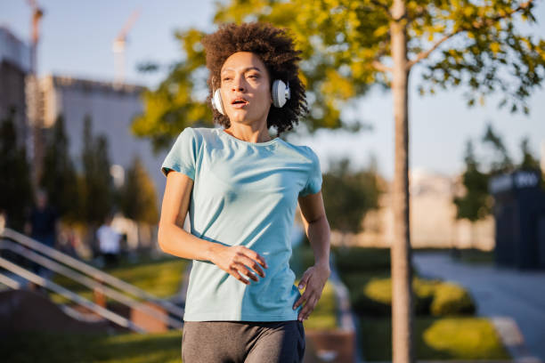 istock Woman jogging outdoors 1383589288