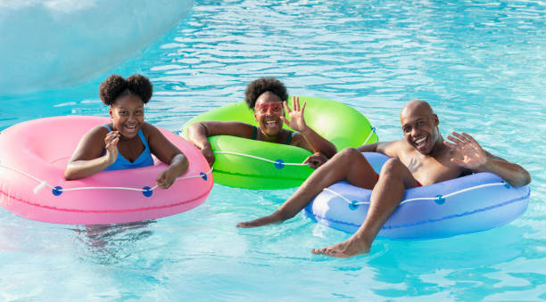 istock African-American family floating on lazy river 1383590923