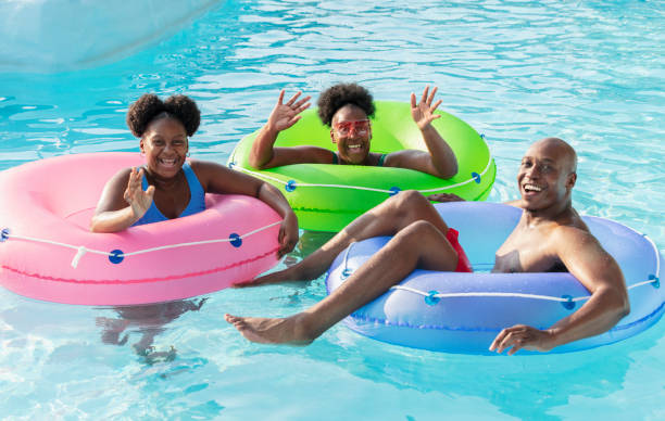 istock African-American family floating on lazy river 1383590926