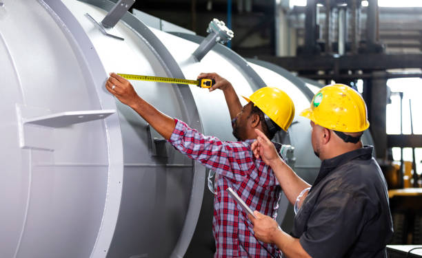 istock Two multiracial men working in metal fabrication plant 1383599683