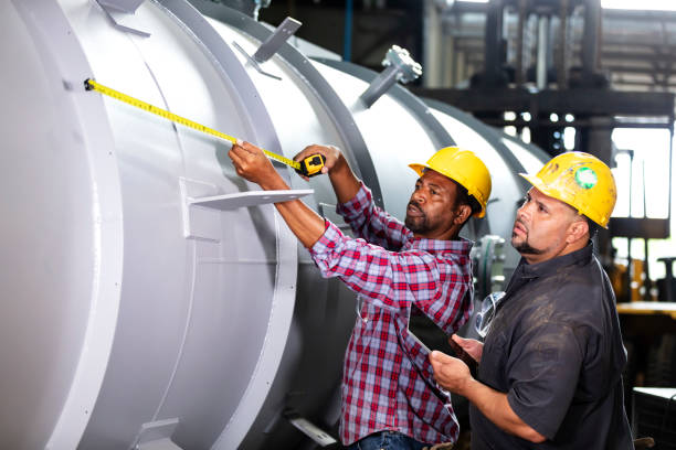 istock Two multiracial men working in metal fabrication plant 1383599701