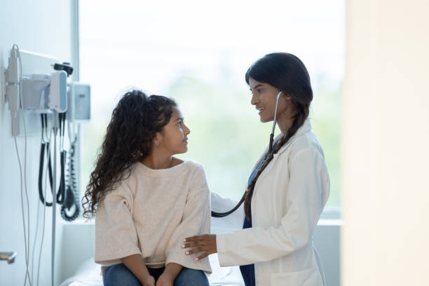 istock Hispanic Girl at a Check-up 1383618486