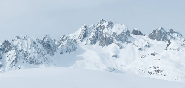 A snow-capped mountain range landscape of the Alps in France
