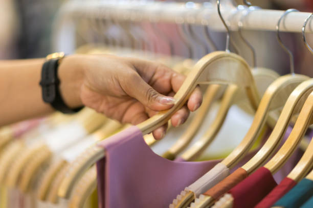 istock Clothes that are arranged on shelves and hangers 1383629641