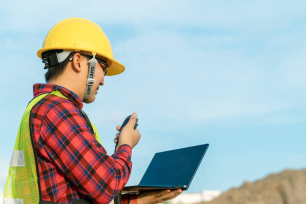 istock Engineer wear safety uniform inspection civil work. Construction engineer supervisor use walkie talkie for manage excavator. asian technician use technology for work today. 1383645615