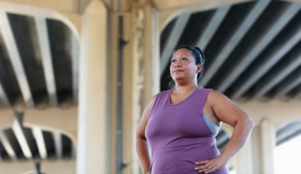 istock Pacific Islander woman, hands on hips 1383691942