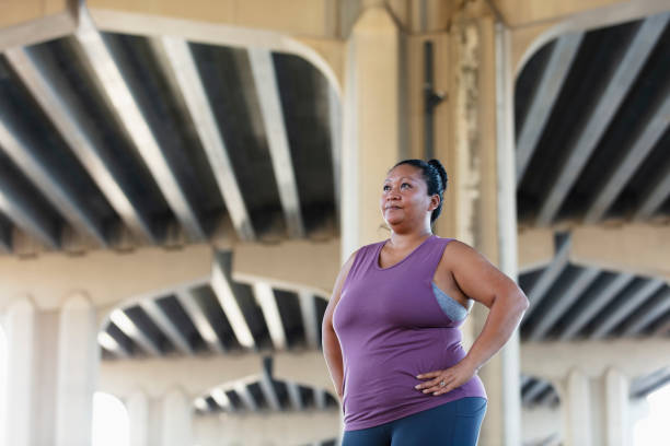 istock Pacific Islander woman, hands on hips 1383691948