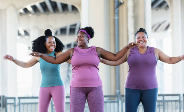 istock Three multiracial women exercise outdoors in urban area 1383691978