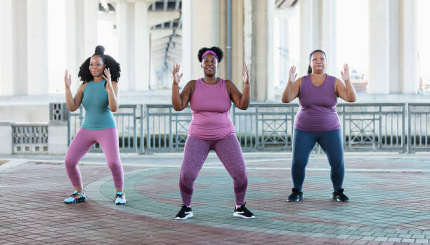 istock Three multiracial women practicing tai chi in urban area 1383692003