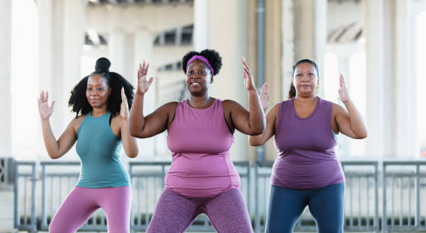 istock Three multiracial women practicing tai chi in urban area 1383692004