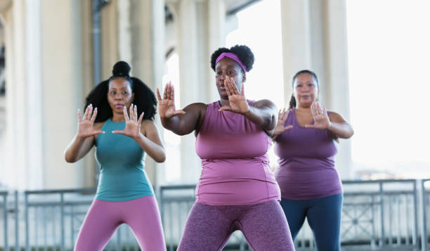 istock Three multiracial women practicing tai chi in urban area 1383692525