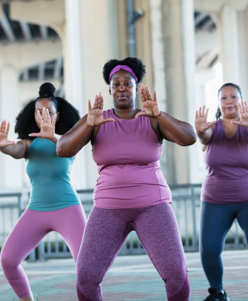 istock Three multiracial women practicing tai chi in urban area 1383692534