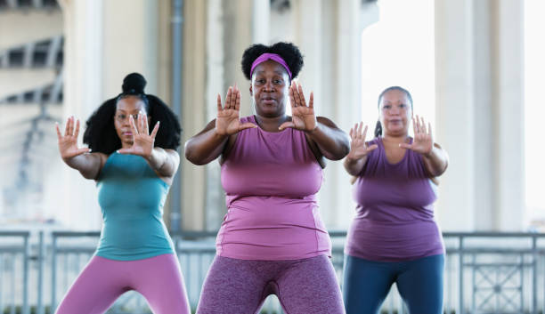 istock Three multiracial women practicing tai chi in urban area 1383692535