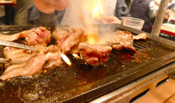 istock Sizzling Meat on a Grill 1383692636