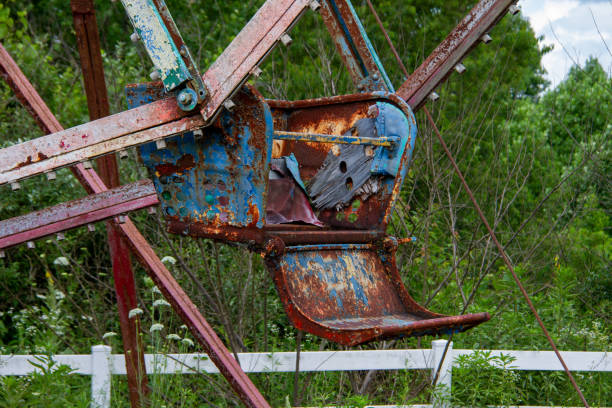 abandoned and rusted Ferris wheel cart