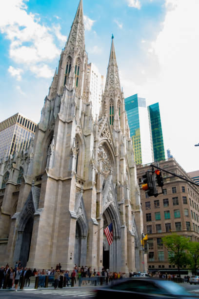 istock Gothic church surrounded by tall modern buildings 1383698561