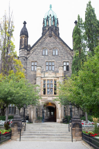 istock Gothic church surrounded by tall modern buildings 1383698565