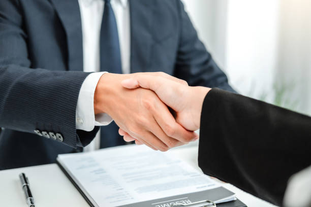 istock Business Shaking hands greeting new colleagues after during job interview 1383698666