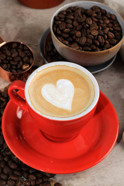 istock latte or Cappuccino with frothy foam, coffee cup top view on table in cafe. 1383698897