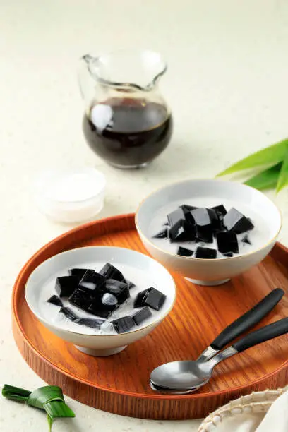 Photo of Es Cincau Hitam or Black Grass Jelly (Cincau Hitam), Indonesian Dessert Made from Cincau Leaf with Coconut Milk and Palm Sugar.