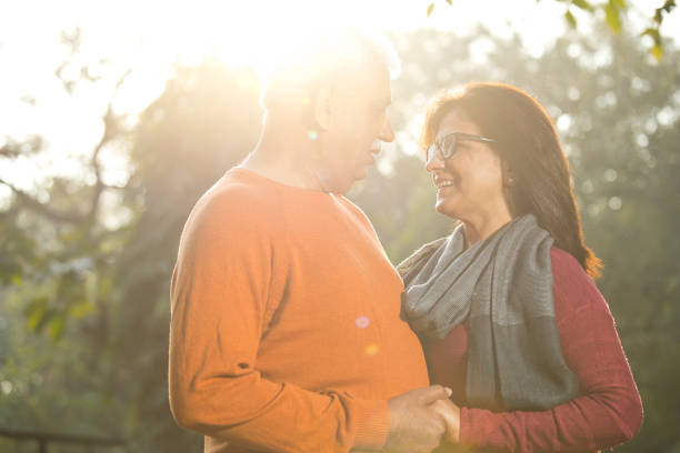 istock Senior couple looking face to face at park 1383706988