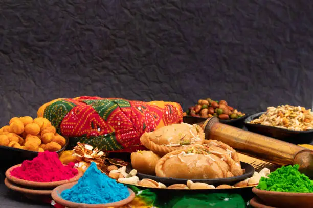 Indian Mithai Gujia Also Called Gujiya, Pirukiya, Pirukia, Pedakiya, Karanji, Basundi Gughra Made Of Suji Ghee Stuffed With Mawa Khoya Chasni Mava And Khoa With Holi Pagadi, Safa Pichkari Gulal Abeer