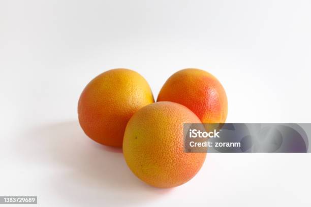 Three Whole Grapefruits On White Background Stock Photo - Download Image Now - Grapefruit, Whole, White Background