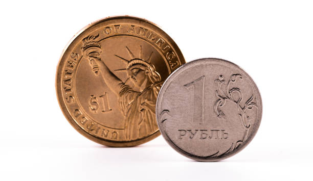 istock Coin 1 Russian ruble and 1 American dollar on a white background 1383736529