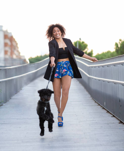 woman walking the dog while pulling the leash, woman dog pull leash fall