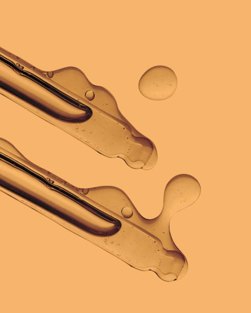 istock Pipette with cosmetic product in water with bubbles. 1383741243