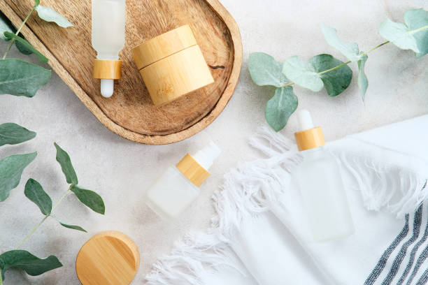 istock SPA natural organic cosmetics set with eucalyptus branches on stone table in bathroom. 1383746596