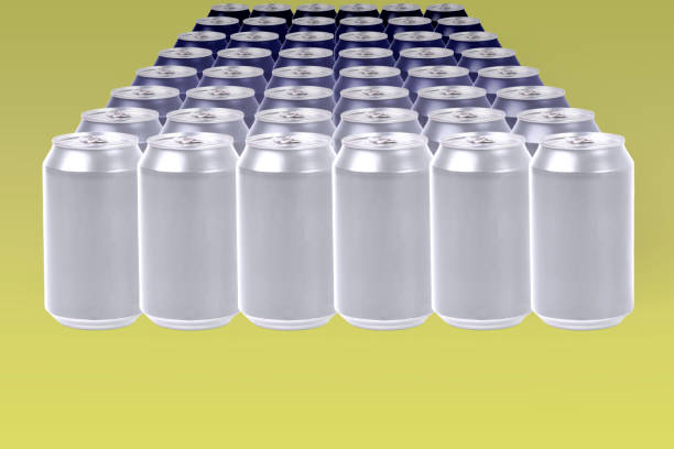 istock Bright aluminum cans forming a blue gradient on a yellow background. Concept color tones 1383747686