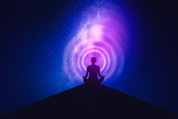 istock Young woman meditating with milky way background 1383761759