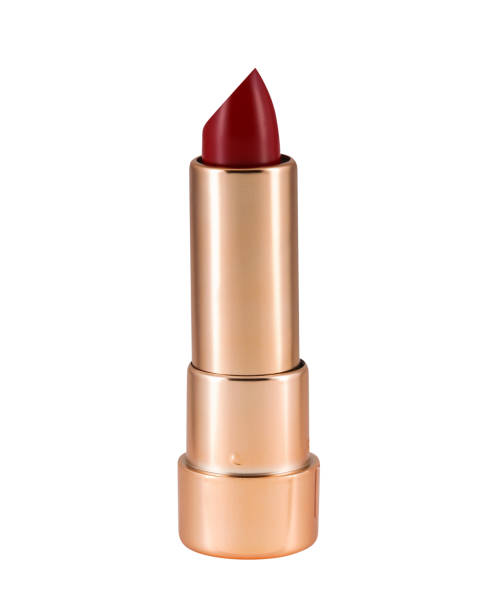 istock Burgundy lipstick in golden container on white background 1383782500