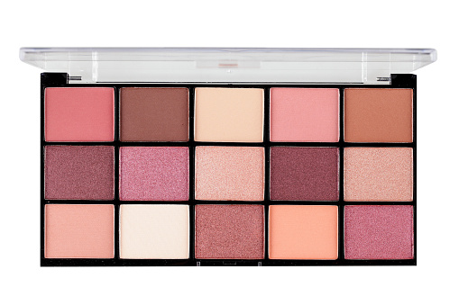 Various eyeshadows in rectangular plastic box with open lid isolated on white, cut out, studio shot