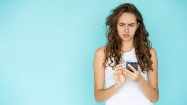 istock mobile communication displeased woman bad 1383816346