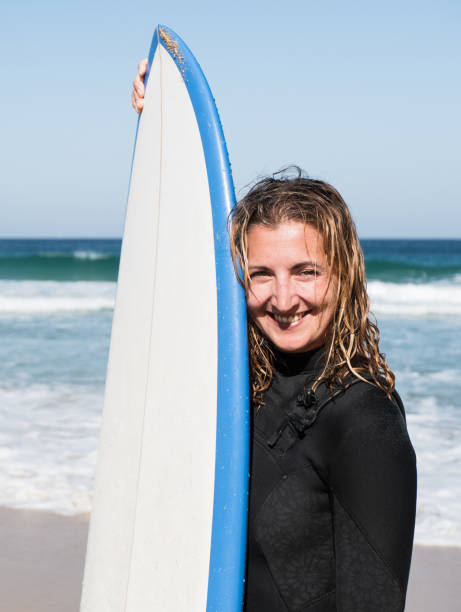 istock Caucasian surfer female portrait 1383816573