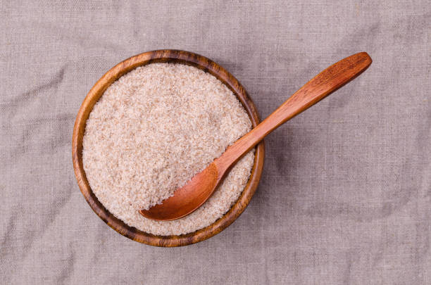 istock Brown psyllium in a wooden bowl 1383816637