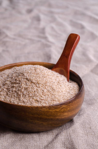 istock Brown psyllium in a wooden bowl 1383816689