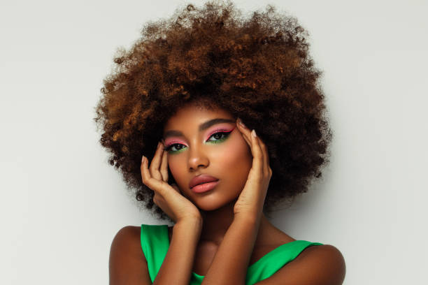 istock Portrait of young afro woman with bright make-up 1383817954